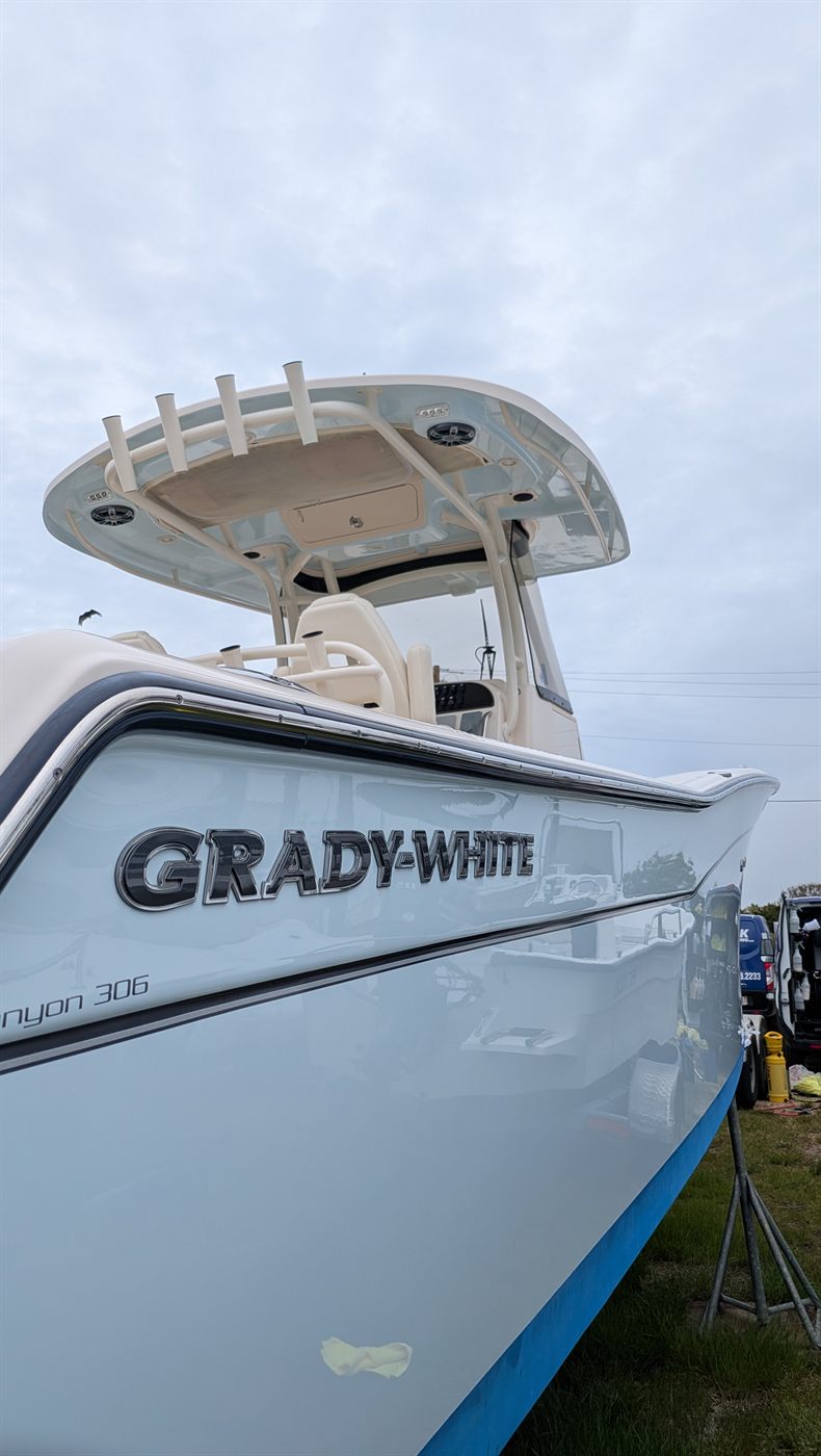 Grady-White Canyon 306 with a light blue hull, polished and ceramic coated by ACK Detailing on Nantucket