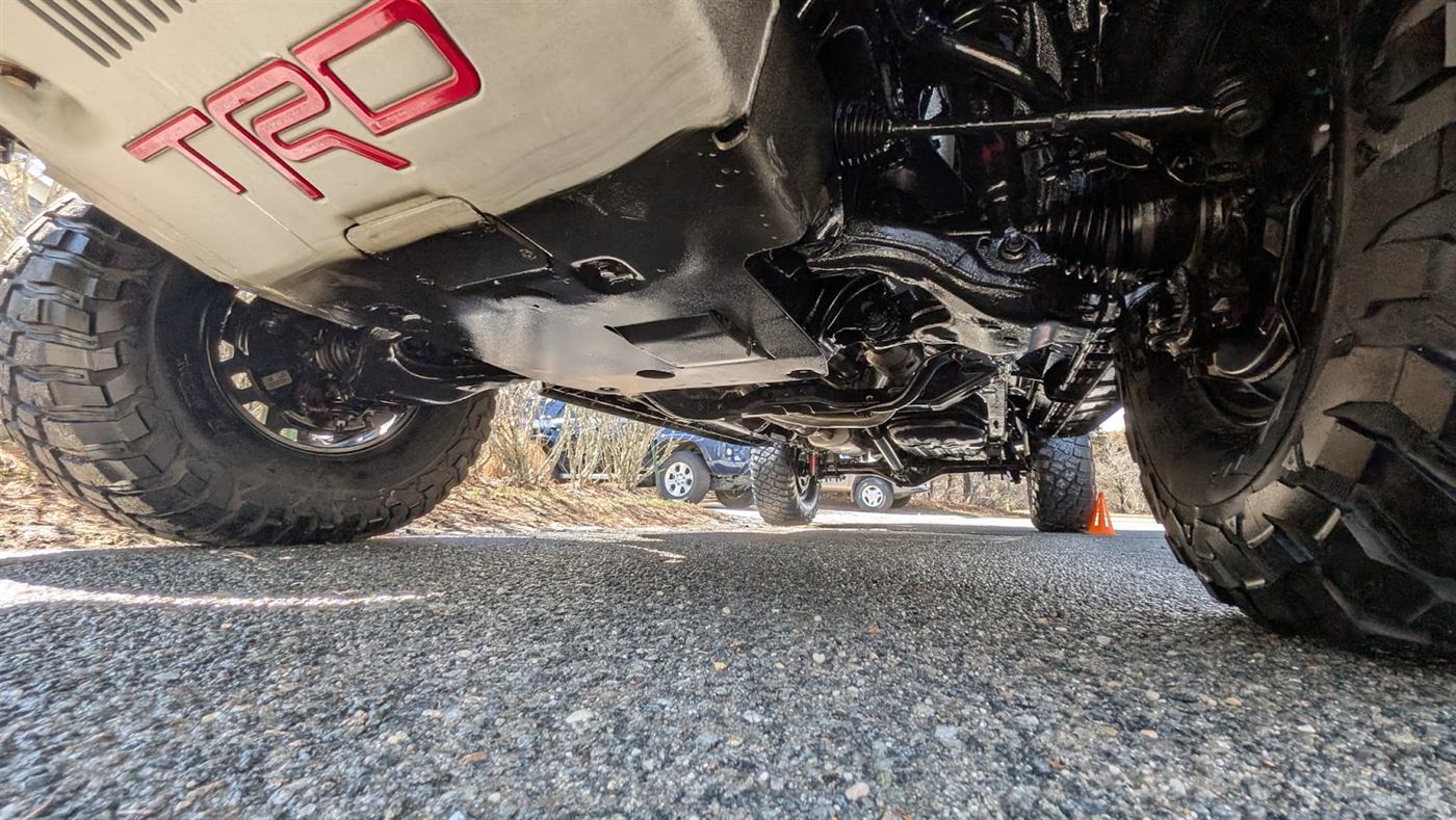 Customer photo — spotless undercarriage on a TRD Toyota after chassis detailing